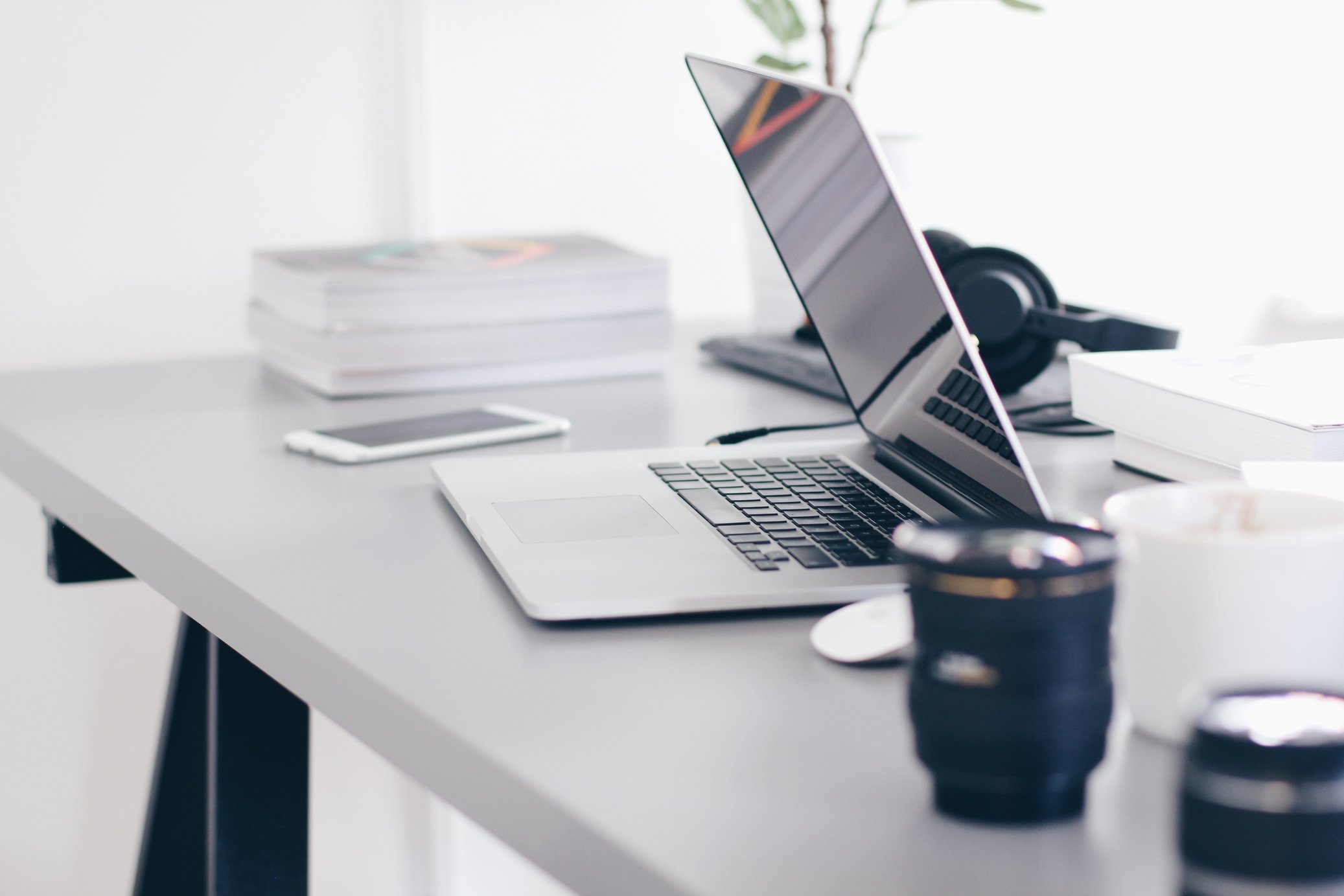 Office Desk with Computer Laptop and Coffee Cup